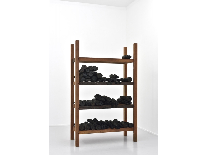 Fire Scripts, 2015 % Charbon de bois et bois / Wood charcoal with wood<br/>180 x 112 x 49 cm	<br/>(70 7/8 x 44 1/8 x 19 1/4 in.)<br/><br/>