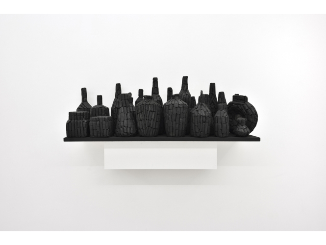 Still life, 2016 % Charbon et pulpe de coton <br/>23 éléments / Charcoal with cotton rag pulp<br/>23 elements<br/>33 x 100 x 30 cm	<br/>(13 x 39 3/8 x 11 3/4 in.)<br/><br/>